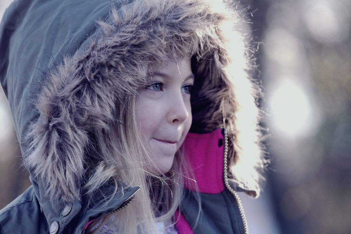 a child wearing a hoodie