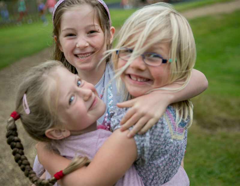 girls hugging each other