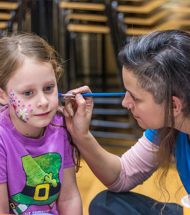 Oxford Active Staff painting a child's face