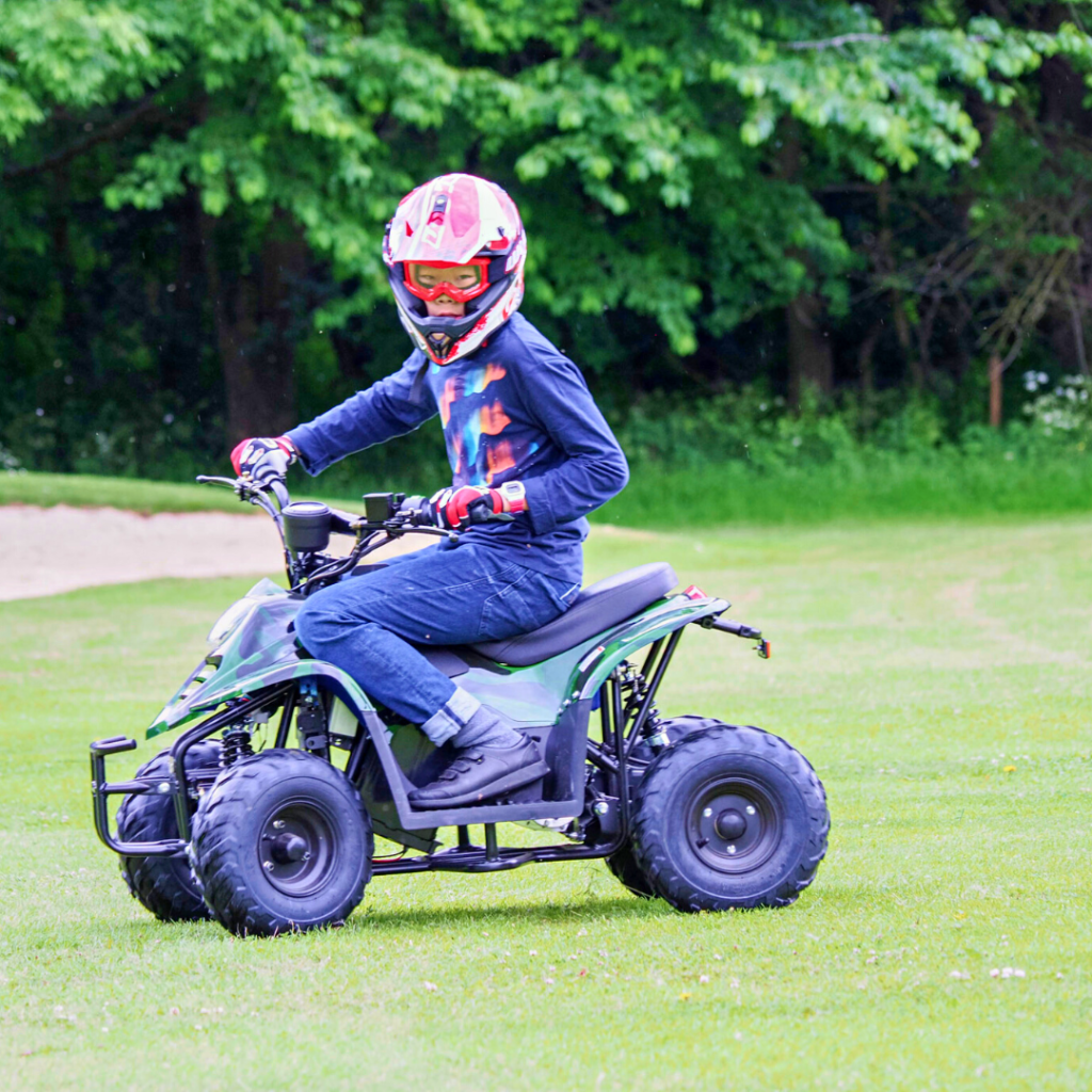 a boy driving a motocycle