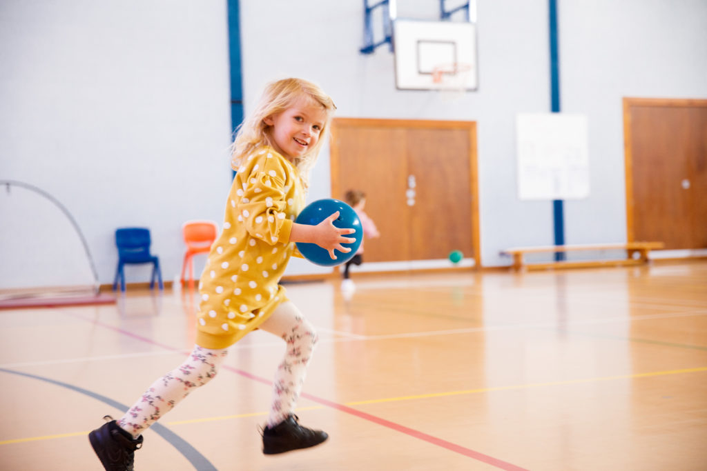 a girl playing basketball