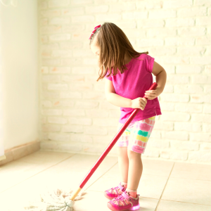 a girl cleaning the floor