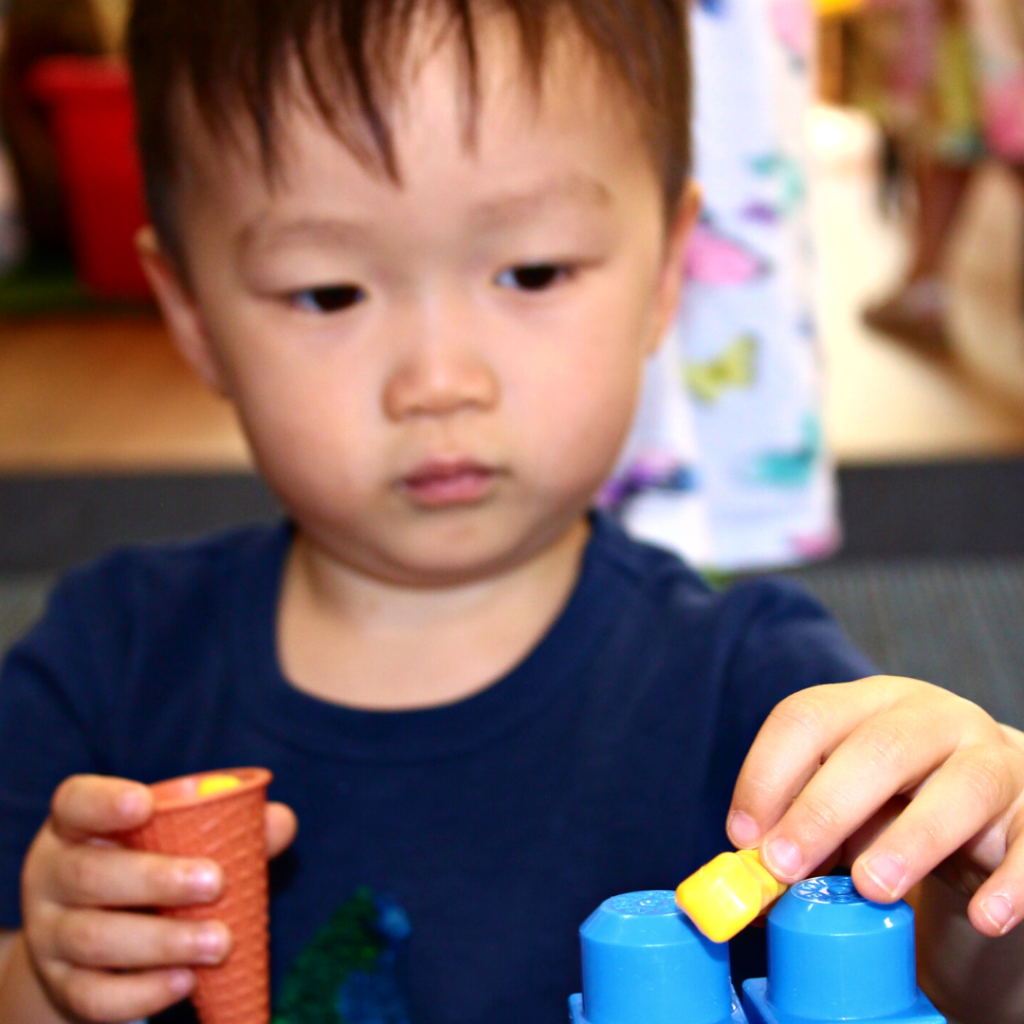 a boy playing with blocks