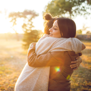 two girls hugging each other