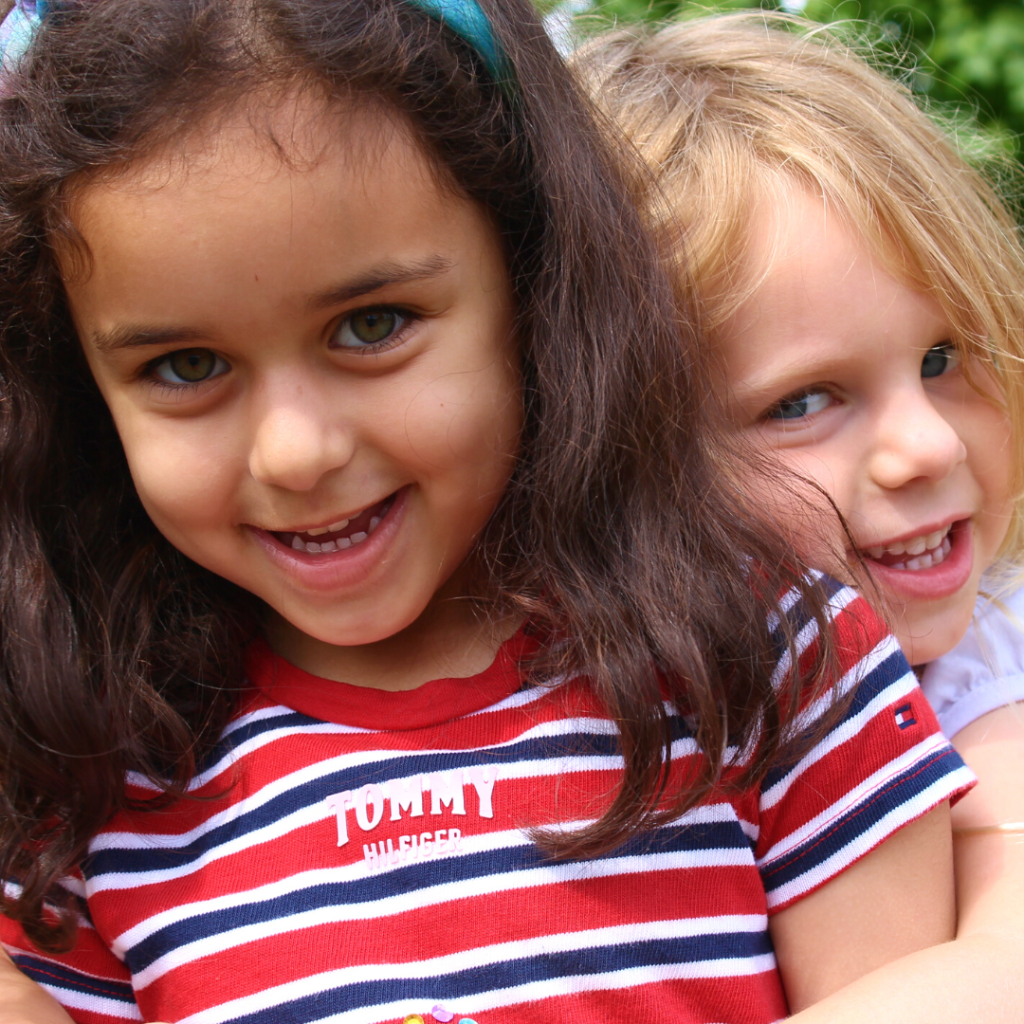 two girls hugging each other