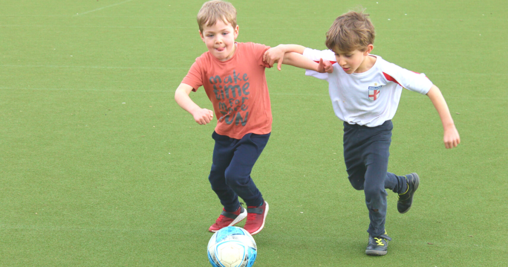 boys playing football